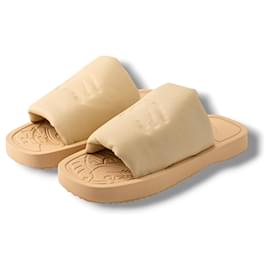 Ciabatte Burberry in pelle beige con logo