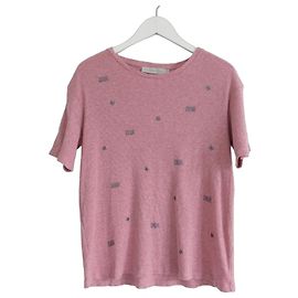 Camiseta Christian Dior para niña con logo de purpurina