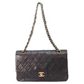 Borsa a tracolla Chanel A01112 in pelle di agnello nera