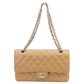 Sac à bandoulière Chanel A01112 en cuir caviar matelassé beige