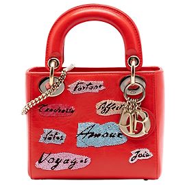 Lady Dior mini in pelle di vitello con perline rossa