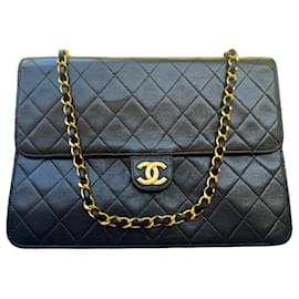 Chanel Classic Flap Bag Schwarz Lammleder