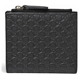 Cartera plegable mini Microguccissima negra Gucci