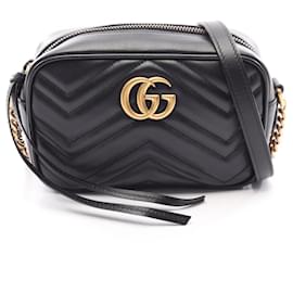 Mini bolsa matelassê Gucci GG Marmont