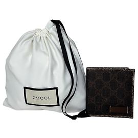 Cartera bifold vintage Gucci en lona con monograma y cuero marrón