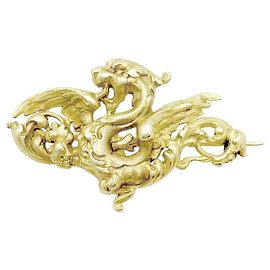 Autre Marque Spilla Chimera in oro giallo.