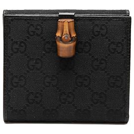 Cartera compacta Gucci de lona GG y cuero negro con detalle de bambú
