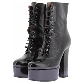 Alaïa Botas de charol negro