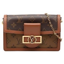 Portafoglio con catena Dauphine in Monogram Reverse marrone Louis Vuitton
