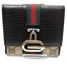 Cartera tríptico para mujer Gucci en piel marrón y lona