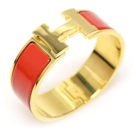 Pulseira Click Clack PM para mulher em esmalte coral e banhada a ouro - Hermès