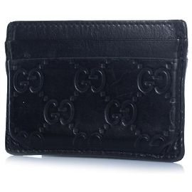 Gucci, black leather monogram embossed card holder