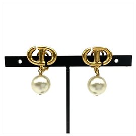 Orecchini a clip dorati Christian Dior con perle artificiali