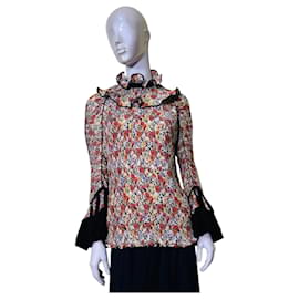 Top plisado floral Tory Burch con cuello de volantes y puños de terciopelo