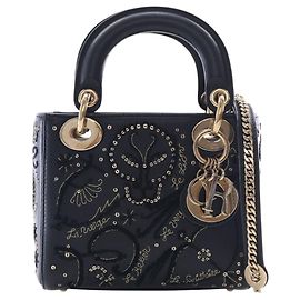 Dior Lady Dior Mini in agnello nero ricamato con paillettes astrologia