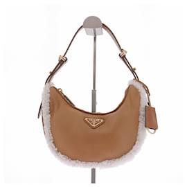 Borsa Arqué Small in pelle e shearling - Prada