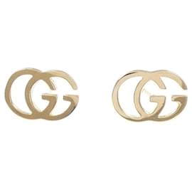 Orecchini Gucci GG Stud in oro giallo 18K