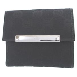 Gucci Bi-Fold-Geldbörse aus schwarzem GG-Canvas und Leder