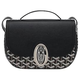 El bolso Goyard 233 de lona Goyardine y piel de becerro Chevroche en color negro es un bolso 233 que combina la emblemática lona Goyardine de Goyard con adornos de piel de becerro. Se caracteriza por la ligereza del material de lona