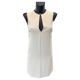 Abito in pelle beige e nero Gucci con logo G argentato