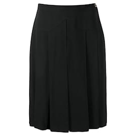 Falda de seda negra de talle alto plisada por encima de la rodilla Chanel de los 90