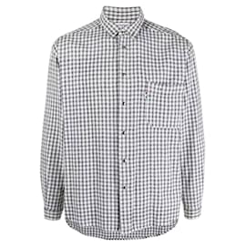 Camicia di flanella a scacchi bianco e nero Moschino anni '90 con punte del colletto con occhielli metallici