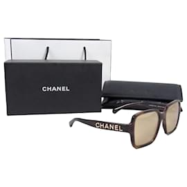 Gafas de sol Chanel cuadradas carey con lentes espejo doradas