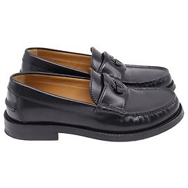 Mocassini Gucci Millennial Ribot Cut Out in pelle nera con logo G intrecciato