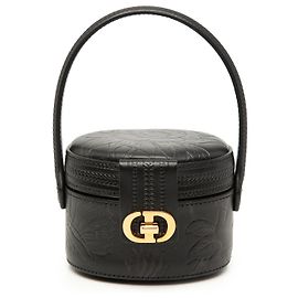 Beauty case Dior in pelle di vitello nera con motivi floreali in rilievo e logo CD