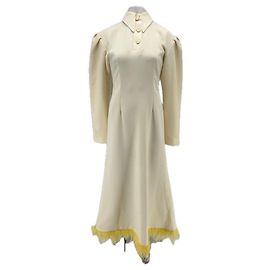 Autre Marque Abito crema con piume gialle