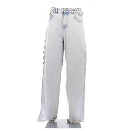 GCDS Jeans blu con gioielli