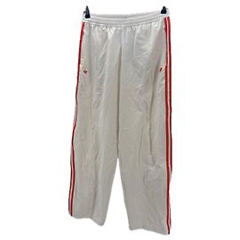 Autre Marque Pantalones deportivos naranja y beige