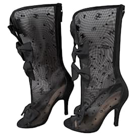 Botas Chanel de malla negras con lazos