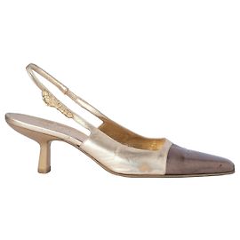 Sandali Gucci di Tom Ford in pelle dorata con testa di tigre