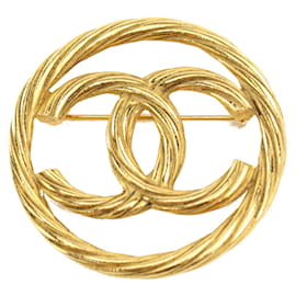 Spilla Chanel Coco Mark in metallo dorato
