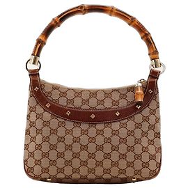 Bolsa Gucci GG Supreme alça de bambu