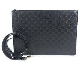 Clutch e borsa a tracolla in pelle nera con logo Gucci Guccissima GG
