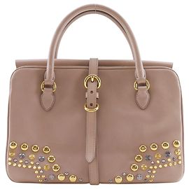 Borsa a mano in pelle borchiata Miu Miu