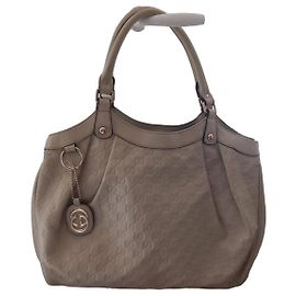 Borsa a mano Gucci in pelle beige monogramma GG