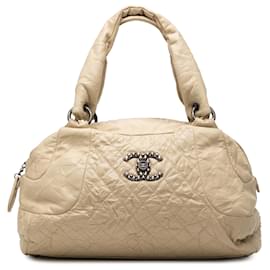 Borsa bowling Coco Rider in pelle di vitello invecchiata trapuntata CC beige Chanel