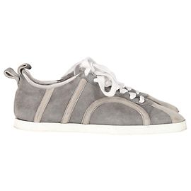 Sneakers con lacci Totême in scamosciato grigio