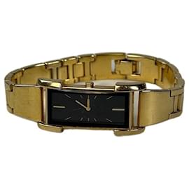 Montre bracelet vintage Saint Laurent, cadran noir et or - Yves Saint Laurent