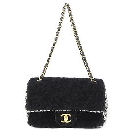 Borsa a tracolla Chanel in tweed nero e pelle