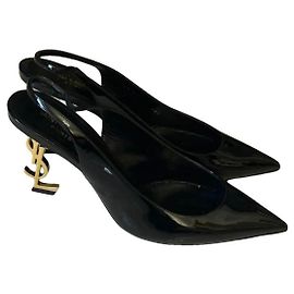 Saint Laurent Opyum Pumps aus schwarzem Lackleder mit goldenem YSL-Absatz