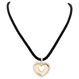 Colgante Poiray "Coeur Secret" en oro de dos tonos y diamantes.