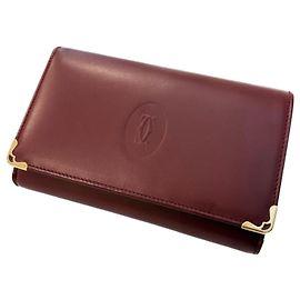 Carteira bi-fold Cartier Must em Bordeaux