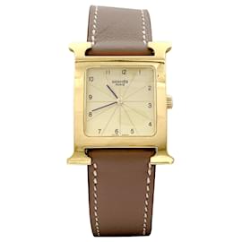 Montre Hermès, "Heure H", plaqué or, acier. 
