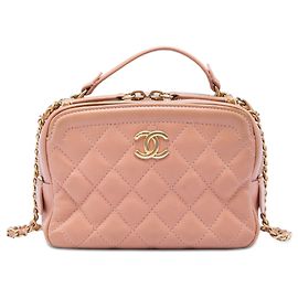 Beauty case Chanel CC trapuntato in pelle di vitello rosa, piccolo, con manico e catena
