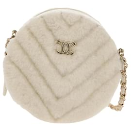 Clutch rotondo Chanel con catena Chevron in shearling mini