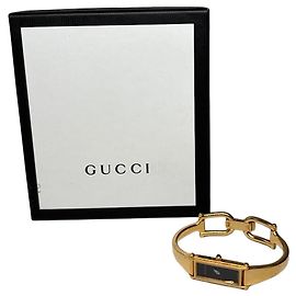 Relógio Vintage Gucci em aço inoxidável dourado com pulseira de couro e caixa